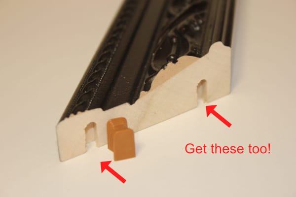 Image showing miter holes on mirror frame edge.